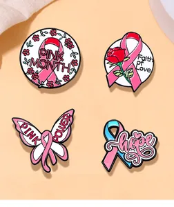 Detailed close-up of four pink ribbon enamel brooch pins with Faith of Love text for awareness