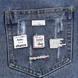 Detailed close-up of chemical formulas and math equations enamel pins on denim pocket