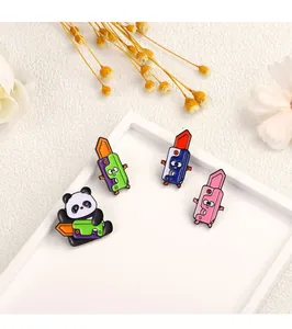 Macro shot of colorful panda and carrot knife enamel pins set on a decorative tray