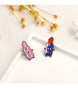 Detailed close-up of cute cartoon enamel panda and lipstick brooches for kids