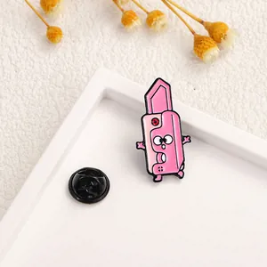 Detailed close-up of a cute pink cartoon lipstick enamel pin with rubber back clutch
