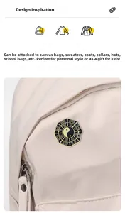 Detail of traditional Yin Yang Bagua brooch pinned on a beige canvas bag fabric