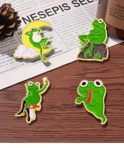 Detailed view of four funny green frog enamel pins on vintage wooden background