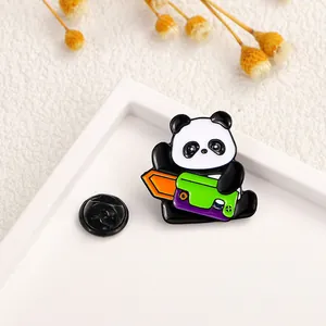 Detail of cute enamel panda brooch with sword on white background with dried flowers