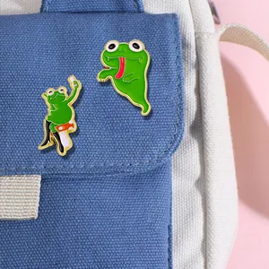 Funny green frog enamel pin set featuring frog on mushroom and ghost frog on canvas bag