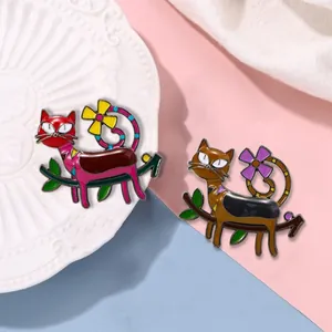 Artistic cat enamel brooch pins with floral tail design on a branch, set of two colors