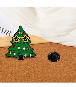 Macro view of cartoon Christmas tree enamel pin with sunglasses on a cork surface