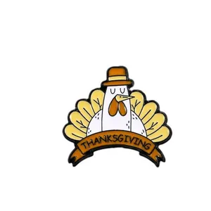 Cartoon thanksgiving turkey enamel pin with yellow hat and thanksgiving text emblem