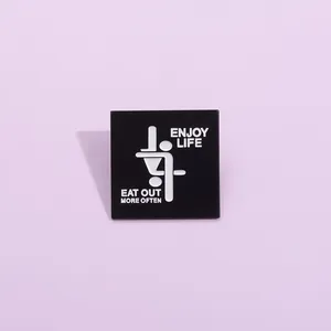 Minimalist square black metal enamel pin with Enjoy Life and Eat Out More Often text