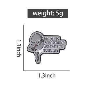 Cartoon dolphin enamel pin showing dimensions 1.1x1.3 inches and 5g weight on white background