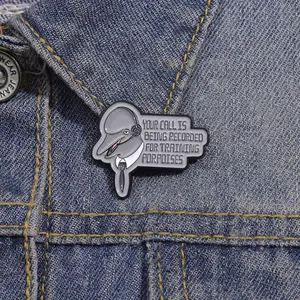 Funny dolphin enamel pin with headset on denim jacket with training porpoises text