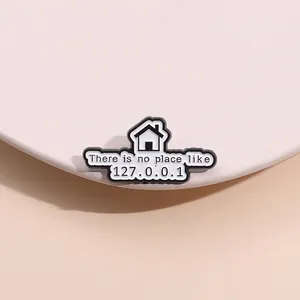Macro detail of enamel pin with There is no place like 127.0.0.1 computer geek text