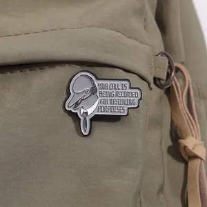 Funny enamel pin featuring a dolphin in a shirt with Your Call Is Being Recorded text
