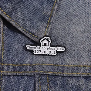 Funny enamel pin featuring There is no place like 127.0.0.1 on blue denim jacket
