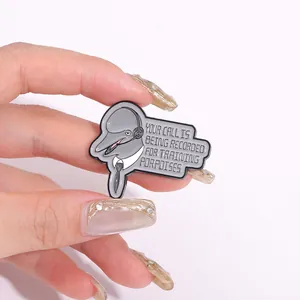 Detail of dolphin enamel pin with Your Call is Being Recorded for Training Porpoises text