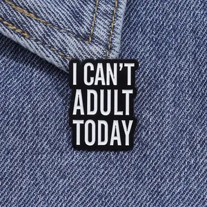 Detail of I Can't Adult Today enamel pin on blue denim fabric with metal texture