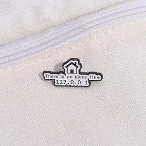 Macro shot of a geek enamel pin featuring 127.0.0.1 IP address on a white canvas bag