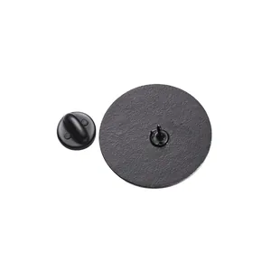 Detailed view of black metal enamel pin back with textured surface and rubber clutch
