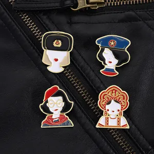 Detail of 4 Russian-style enamel pins with traditional hats on black leather