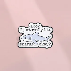 Shark enamel pin badge with Look I just really like sharks quote on pink background