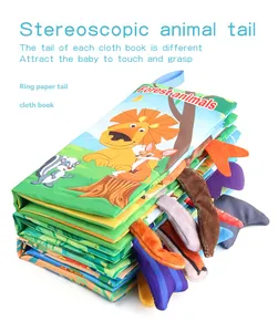 Detailed view of forest animal cloth book featuring textured tails and lion print