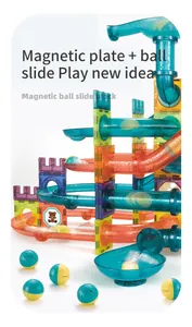 Detail of colorful magnetic tiles and ball slide blocks with bear pattern and rolling balls