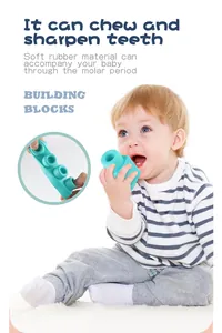 Detail of soft rubber building block for baby molar period showing squeezable material