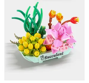 Close-up of DIY building block succulent plant in a blue pot with engraved Succulent text