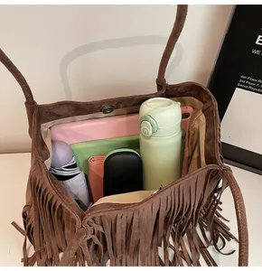 Interior view of large coffee brown suede tote bag showing its spacious capacity and lining