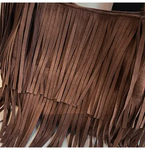 Close-up of the vintage brown suede leather tote bag featuring tiered tassel fringe detail