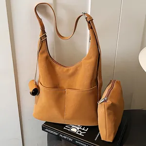 Chic camel faux leather tote bag set with two front pockets and matching pouch