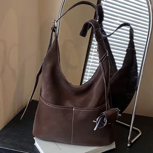 Deep brown retro leather tote bag with contrast stitching and wide shoulder strap