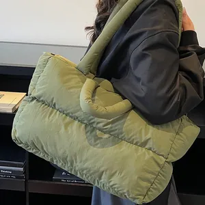 Olive green quilted puffer tote bag with thick shoulder straps for autumn winter commute