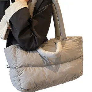 Silver grey quilted puffer tote bag with dual handles and puffy nylon texture