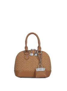 Detailed front view of brown shell bag showing woven texture and mini bag charm