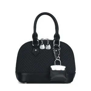 Classic black shell bag with herringbone pattern texture and silver hardware accents