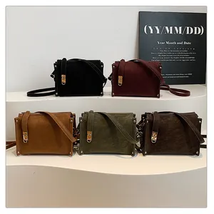Five vintage matte box bags with gold latches in black, burgundy, caramel, and green