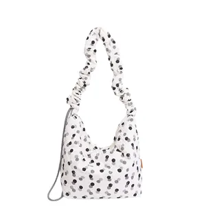 Polka dot hobo bag with ruched wide handle and crossbody strap in minimalist white