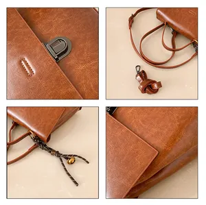 Detailansicht der braunen Vintage-Tasche mit Bronze-Schloss und gewebtem Quasten-Anhänger