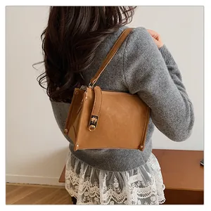 Brown retro square shoulder bag shown on model for daily style and size reference