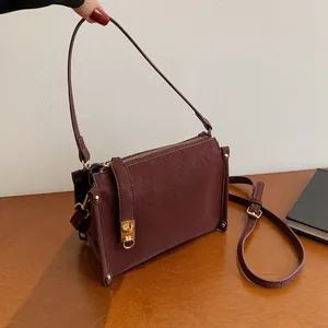 Vintage burgundy square shoulder bag with matte finish and gold metallic hardware