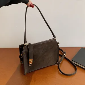Retro dark brown square shoulder bag with gold hardware and dual adjustable straps