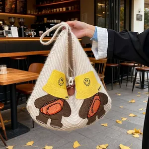 Chic cream knitted tote bag featuring cute cartoon bear patches and wide shoulder strap