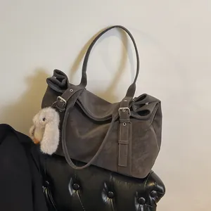 Retro grey matte tote bag with plush bunny pendant and metal buckle shoulder straps