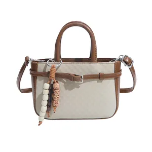 Retro cream checkered mini handbag with brown leather trim and ethnic beaded charm