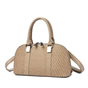 Chic woven tote bag in khaki with silver hardware and adjustable shoulder strap