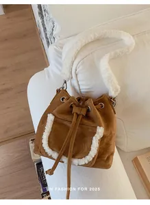 Close-up of brown faux suede bucket bag with white faux fur trim and drawstring