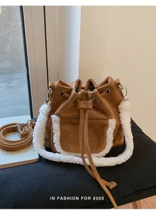 Detail of camel suede bucket bag with white faux fur trim and drawstring closure