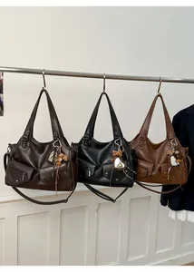 Detailed comparison of vintage leather tote bags in dark brown, black, and tan colors