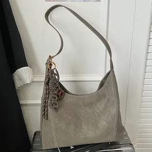 Large taupe hobo shoulder bag in matte PU leather with decorative fashion keychain